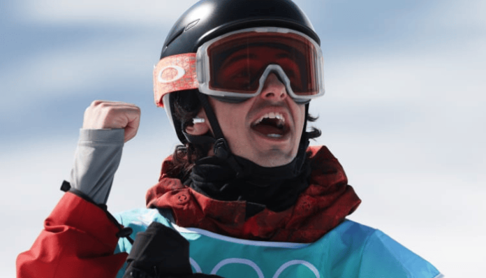 Mark McMorris of Team Canada reacts after finding his earbud during the Men’s Snowboard Big Air Qualification on Day 10 of the Beijing 2022 Winter Olympics at Big Air Shougang on February 14, 2022 i