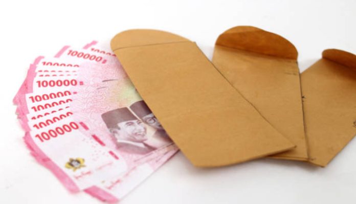 Ilustrasi uang THR (Foto/iStockphoto)