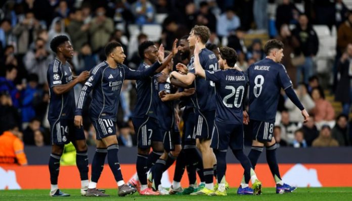 Real Madrid merayakan gol kemenangan ke gawang Manchester City